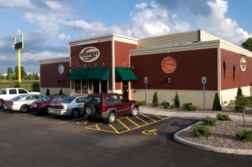 a car dealership with cars parked in a parking lot at Fairfield Inn & Suites by Marriott Verona in Verona