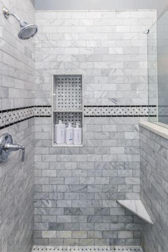 a bathroom with a shower with two toilets in it at Luxury Brownstone - Walk to ALL - Washington Park in Cincinnati