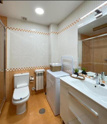 a bathroom with a toilet and a sink at Las Terrazas de Vigo - Paula in Vigo