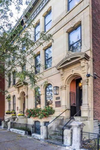 a building with a staircase in front of it at Luxury Brownstone - Walk to ALL - Washington Park in Cincinnati