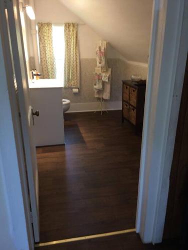 a bathroom with a sink and a toilet in a room at Charming Farmhouse in the City, Near Wine Country in Belleville