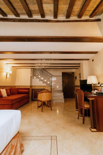 a living room with a couch and a table at Hotel Pantheon in Rome