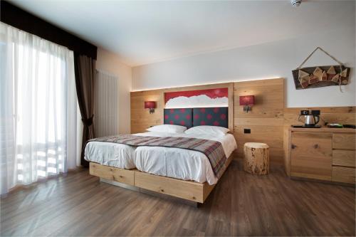 Voodi või voodid majutusasutuse Chalet Marcora toas