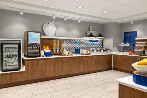 an apple store with a counter with an appleaptop at Holiday Inn Express Hotel & Suites Hagerstown by IHG in Hagerstown