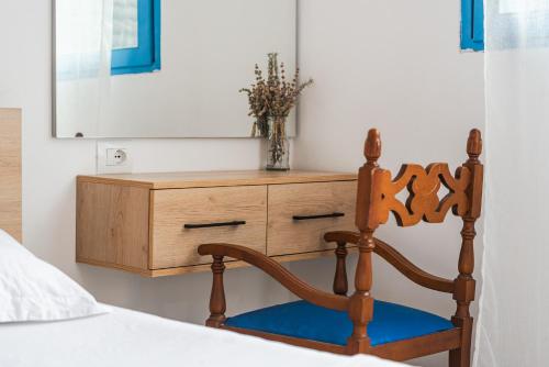 a bedroom with a bed with a dresser and a mirror at Central Vila 5 in Durrës