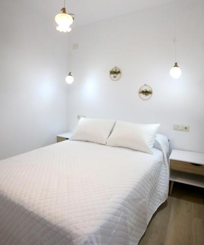 Ένα ή περισσότερα κρεβάτια σε δωμάτιο στο Apartamentos turísticos La Estación