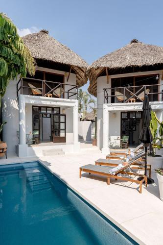 a villa with a swimming pool and a resort at Casa Nopal-Private Pool, Chic, Steps from Beach in Puerto Escondido