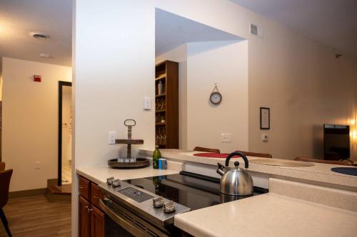 a kitchen with a tea kettle on a stove at City Hall Clerk's Office in Rochester