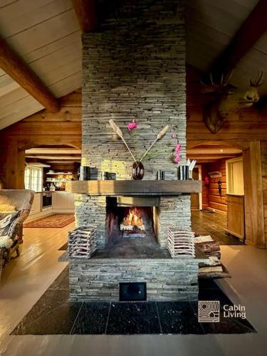 Gambar di galeri bagi Log cabin in Hafjell with ski in ski out, sauna and view di Hafjell