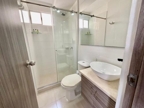 a bathroom with a shower and a toilet and a sink at Hermoso Apto en Zona Norte Baq in La Mina