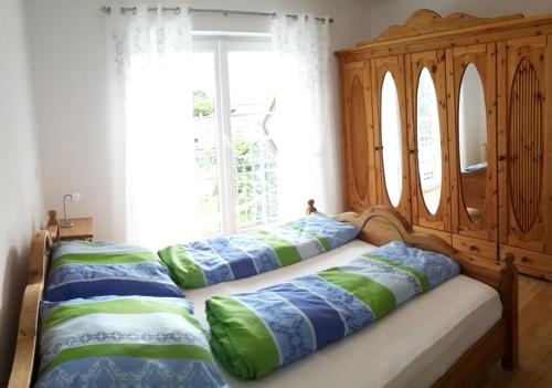 a bedroom with two beds and a window at "Villa Sabine" in Waidhaus