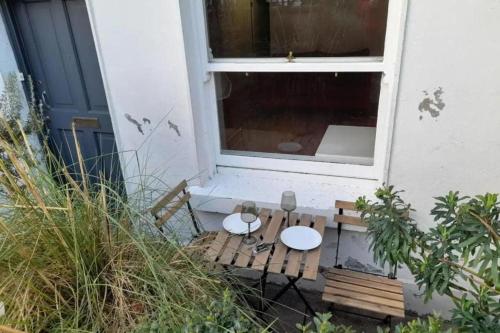 a small table in front of a window at Cosy flat in Portobello in Dublin