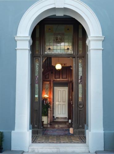 an entrance to a house with a wooden door at Harpers House in Cape Town