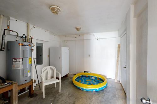 a room with a tub in the corner of a room at Croaker #5A-CAC in Buxton