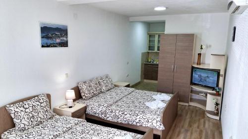 a small room with a bed and a couch at Apartments Tomic in Ohrid
