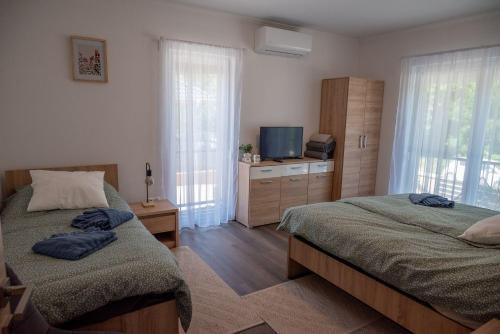Postel nebo postele na pokoji v ubytování Pipi és Papi vendégház