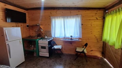 Kuchyň nebo kuchyňský kout v ubytování Cabañas "Mainimbu" 2