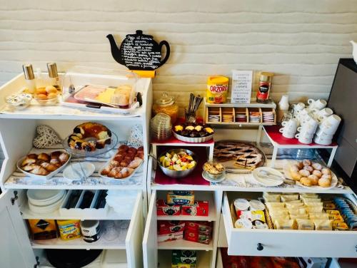a refrigerator filled with lots of different types of food at Gemini Suite in Rome