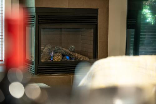 a fireplace with some food inside of it at Pacific Forest Beach House in Parksville