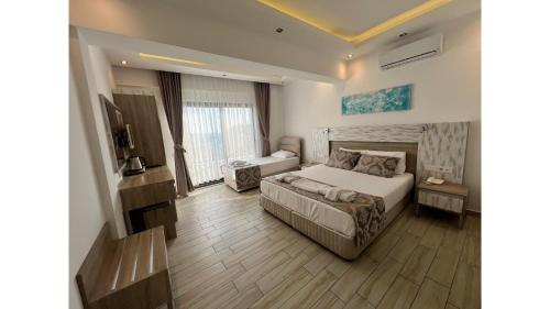 Katil atau katil-katil dalam bilik di Sardunya Andifli Otel