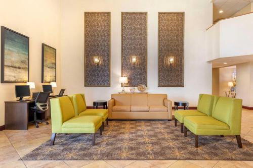 a waiting room with two chairs and a couch at Best Western Plus West Covina Inn in West Covina