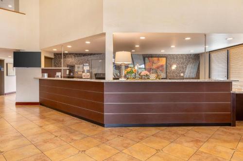 a lobby with a bar in a hotel at Best Western Plus West Covina Inn in West Covina