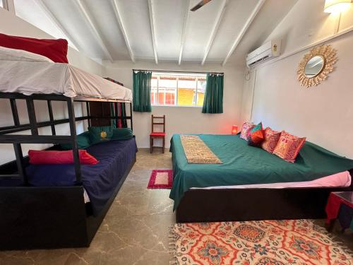 Postel nebo postele na pokoji v ubytování Art Resort Goa