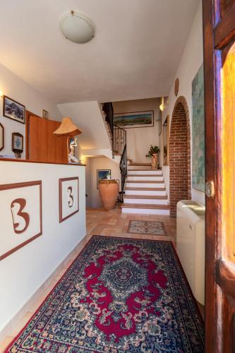 a hallway with a rug on the floor at Il Belvedere in Civita