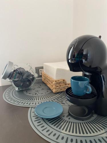 a coffee maker sitting on top of a table at Casa Morena in Rome