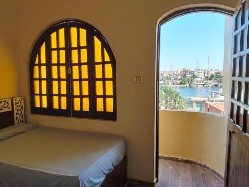 Postel nebo postele na pokoji v ubytování Aswan Nile view house