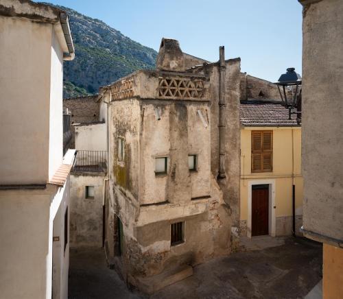 an old building in the middle of a street at Il Belvedere in Civita