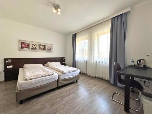 Una cama o camas en una habitación de Hotel Rennekamp