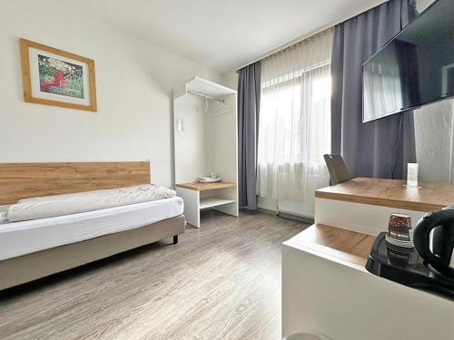 Una cama o camas en una habitación de Hotel Rennekamp