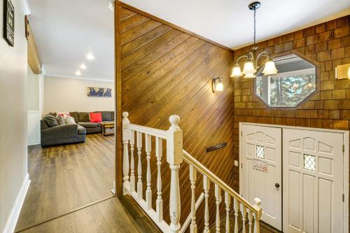 a staircase in a home with a wooden wall at Walk to Donner Lake Truckee Cabin with Private Deck in Truckee