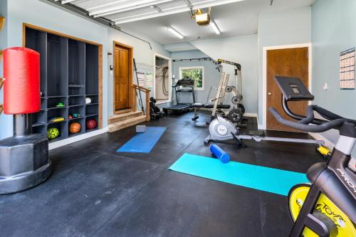 a gym with a treadmill and exercise equipment at Forest Escape in Cle Elum