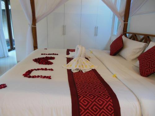 Ένα ή περισσότερα κρεβάτια σε δωμάτιο στο HK Villa Bali