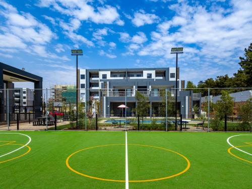 a basketball court in front of a building at Glen Haven in Midrand