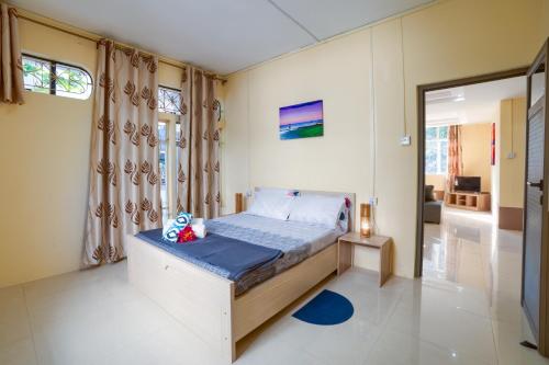 a small bedroom with a bed in a room at Sunset Bliss Pereybere 2 in Pereybere