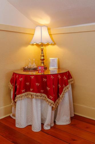 a table with a lamp on top of it at Historic Wilson-Guy House in Niagara on the Lake