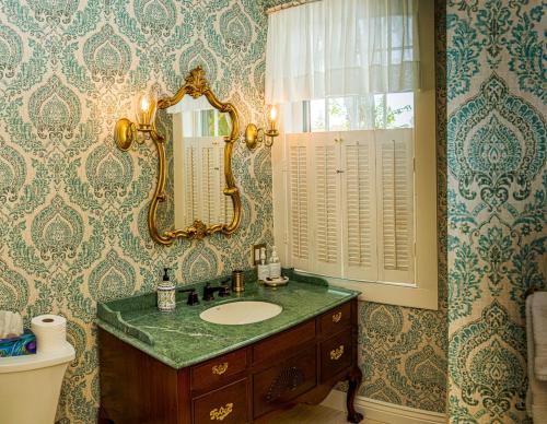 a bathroom with a sink and a mirror at Historic Wilson-Guy House in Niagara on the Lake