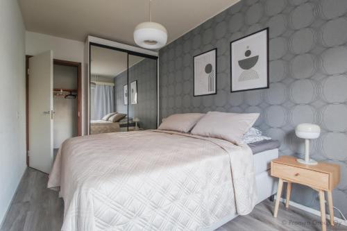 Postel nebo postele na pokoji v ubytování Pramea Apartments Taukotupa