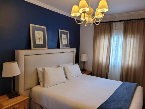 Ένα ή περισσότερα κρεβάτια σε δωμάτιο στο Apartamento Lá-Bas