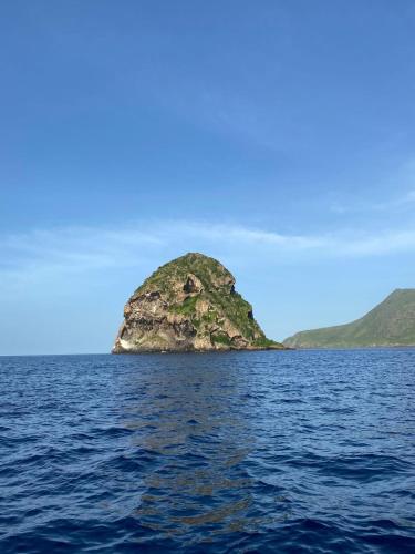 a small island in the middle of the water at Résidence Flores De Maria in Le Marin