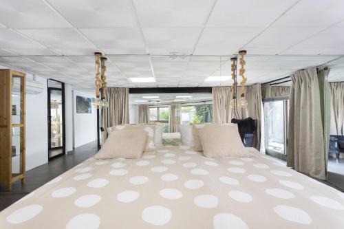 a large bed in a room with a large rug at OkStay Loft Victoria Top Tenerife in La Victoria de Acentejo