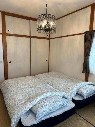 Postel nebo postele na pokoji v ubytování Guest House "Ro"kumano