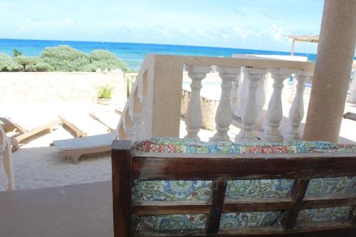 a balcony of a beach with the ocean in the background at Punta Piedra studios in Isla Mujeres