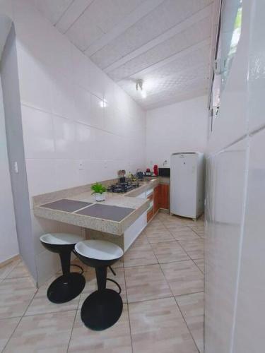 Η κουζίνα ή μικρή κουζίνα στο Infinity House hospedagem