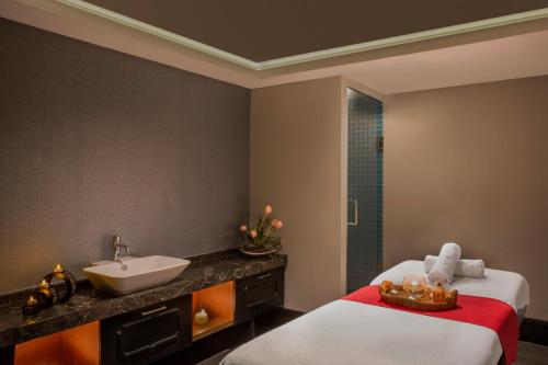 a bathroom with two beds and a sink at IC Hotels Santai Family Resort - Kids Concept in Belek