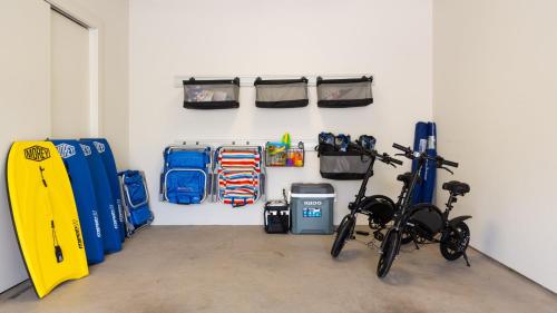 a garage with a bike parked in a room at ❤PiH❤ A Sea-nic Escape Stunning Ocean View Mauna Kea Resort eBikes in Hapuna Beach