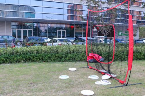 a goal with frisbees on the ground in a field at Crowne Plaza Suzhou East Taihu by IHG in Suzhou